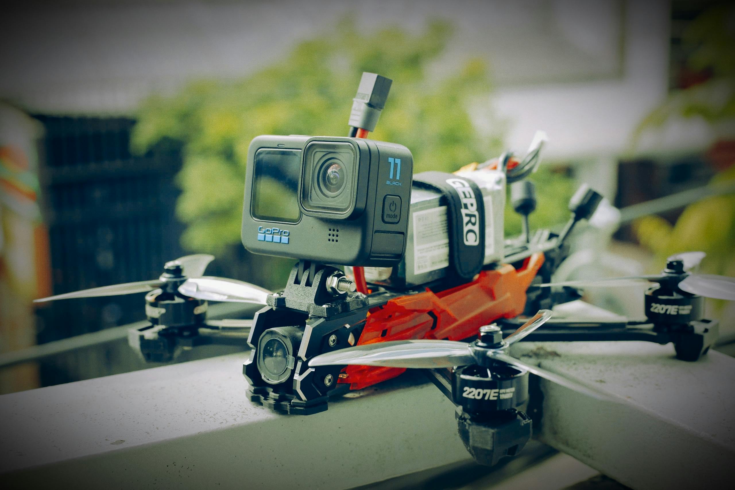 Close-up photo of a drone equipped with an action camera, captured outdoors in Vietnam.